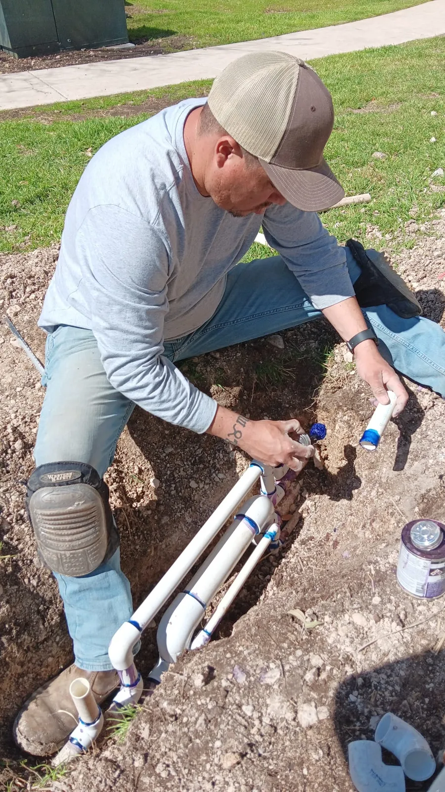 Team member completing an irrigation connection